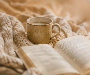 Book, blanket and warm drink